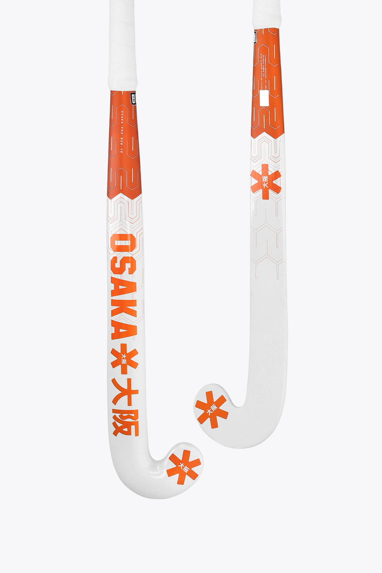 Orange and white field hockey stick head with curved hook and star graphics