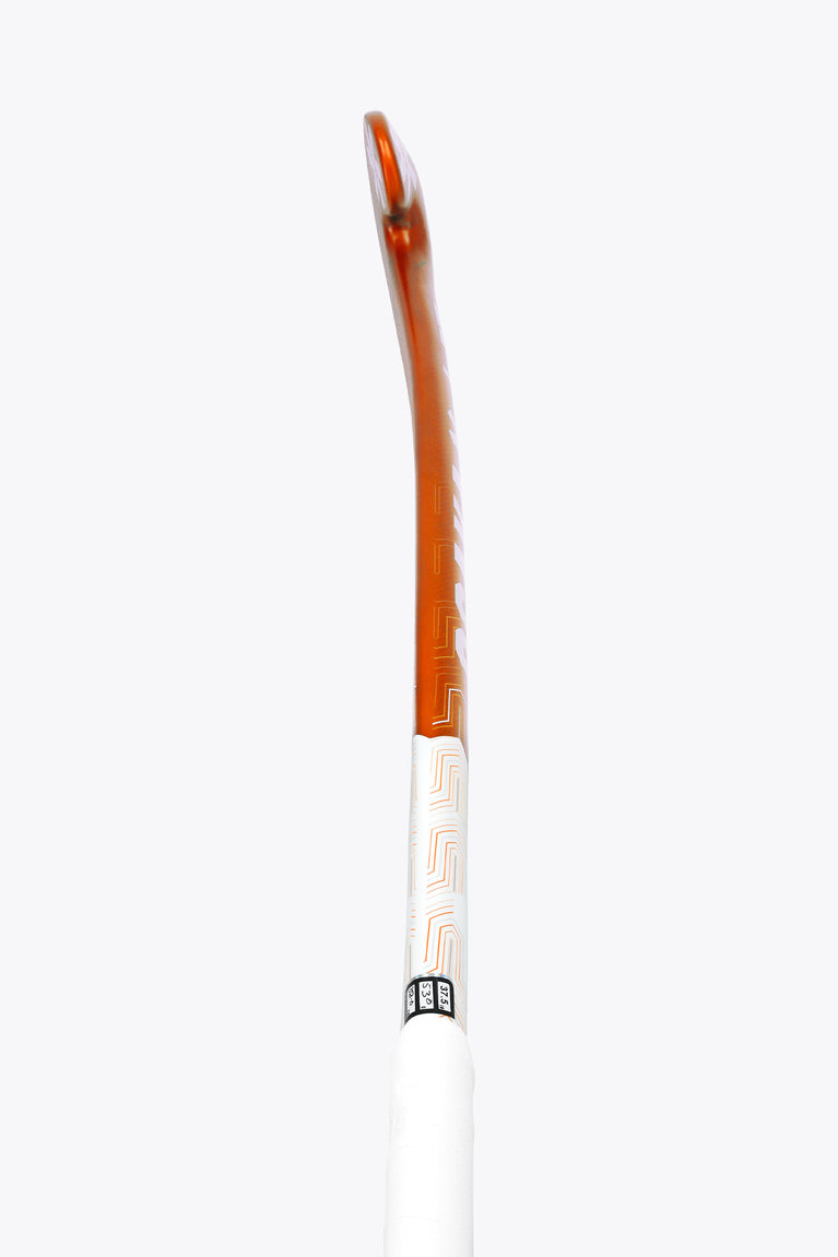 Field hockey stick with orange top edge and white shaft, vertical side view
