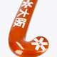 Bright orange hockey stick head with star graphics and textured grip