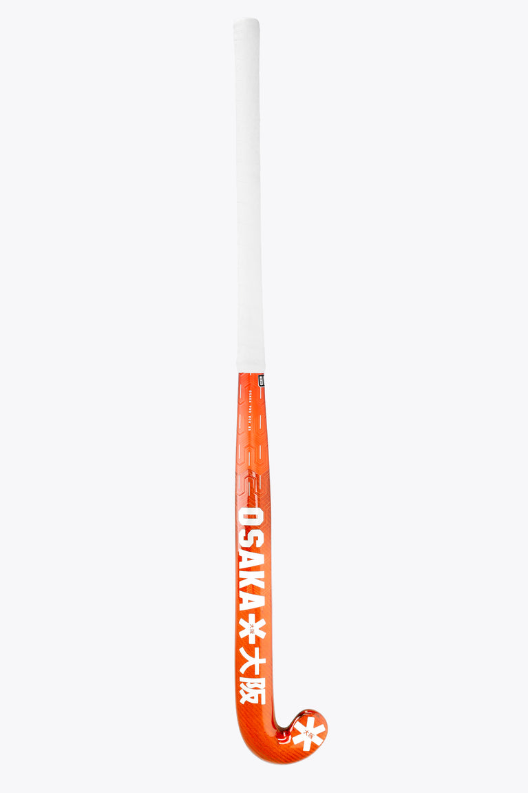 Bright orange curved field hockey stick end with vertical text and white shaft