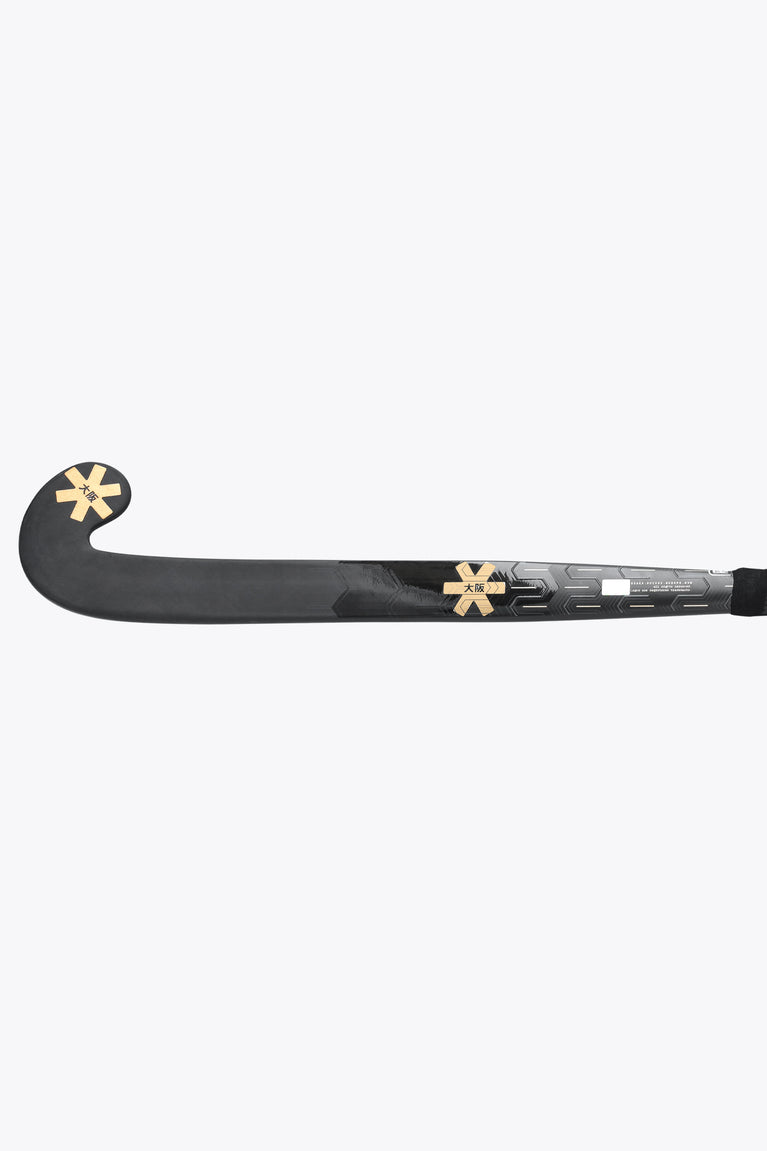Field hockey stick with dark curved blade and gold X-style logo on shaft