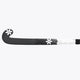 Field hockey stick with black blade and patterned white shaft, side view