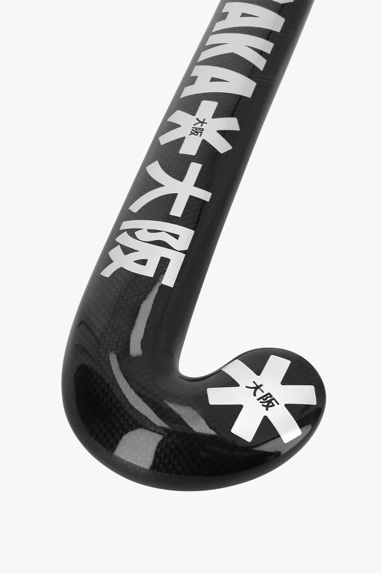 Curved dark field hockey blade with large printed characters and star logo
