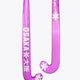 Purple low-bow field hockey stick showing curved blade and printed shaft
