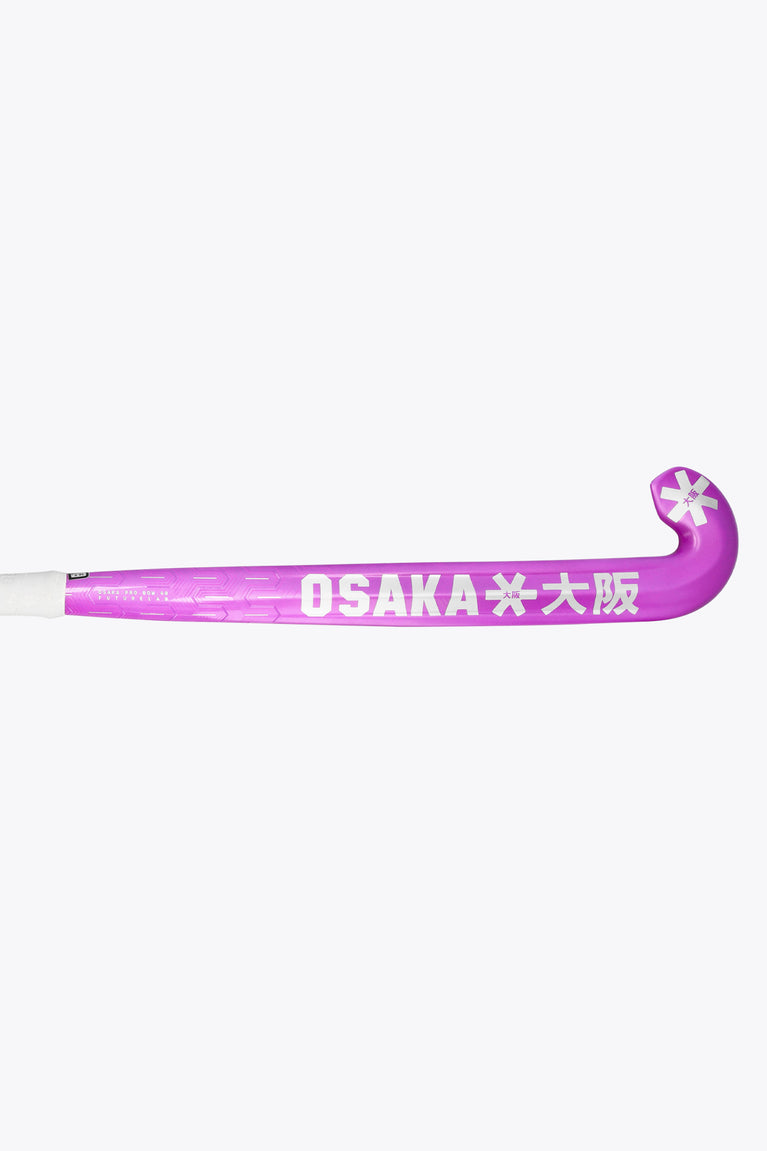 Purple field hockey stick with OSAKA lettering on the shaft and curved head