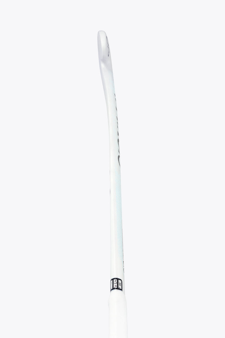 White field hockey stick shaft with small black label near midsection
