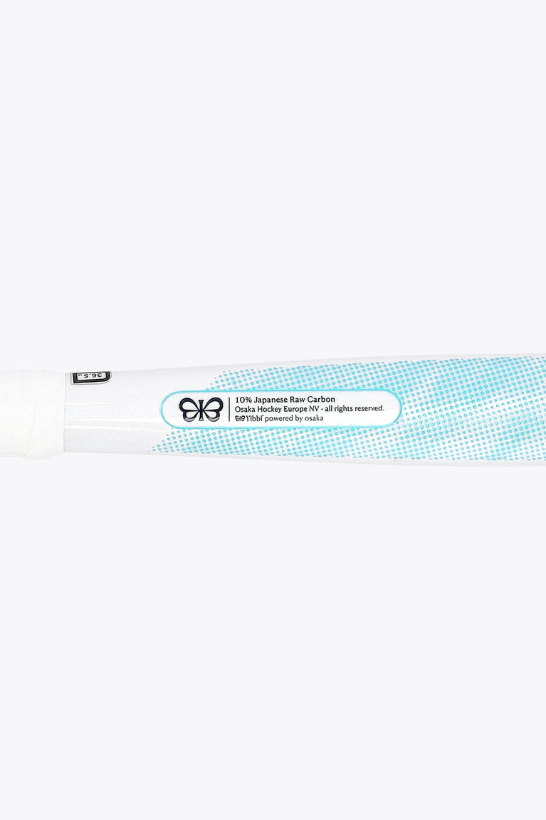 White field hockey stick with blue info label along the shaft