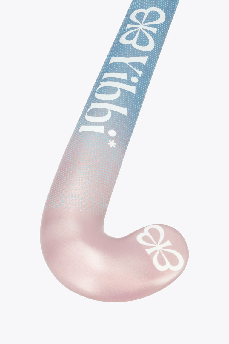 Field hockey stick head with blue-to-pastel pink design and grooved texture