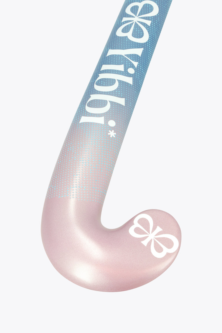 Field hockey stick head angled view with blue upper and pastel pink lower curve.