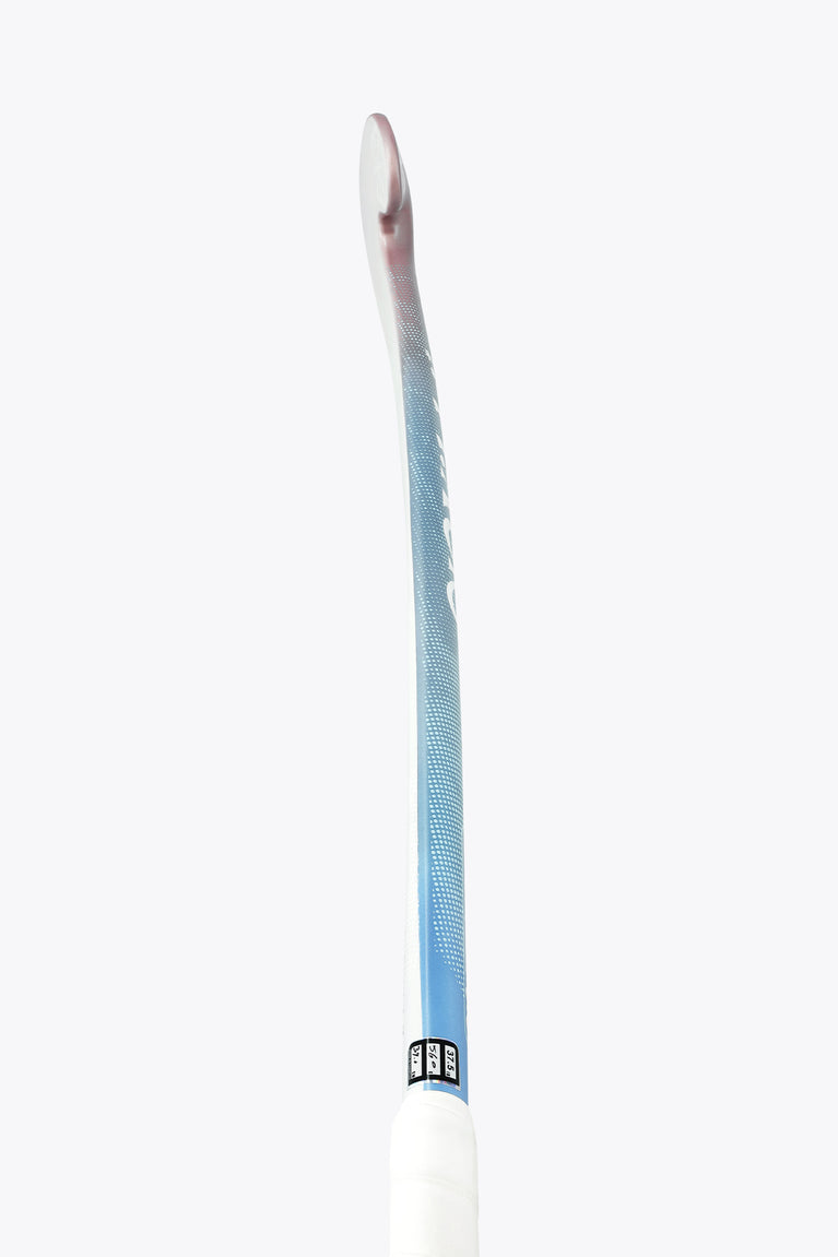 Field hockey stick side profile with blue shaft and white handle end.