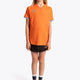 Girl wearing the Osaka Kids Jersey in Orange. Front view