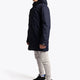 Boy wearing the Osaka Kids Stadium Jacket in Navy. Side view