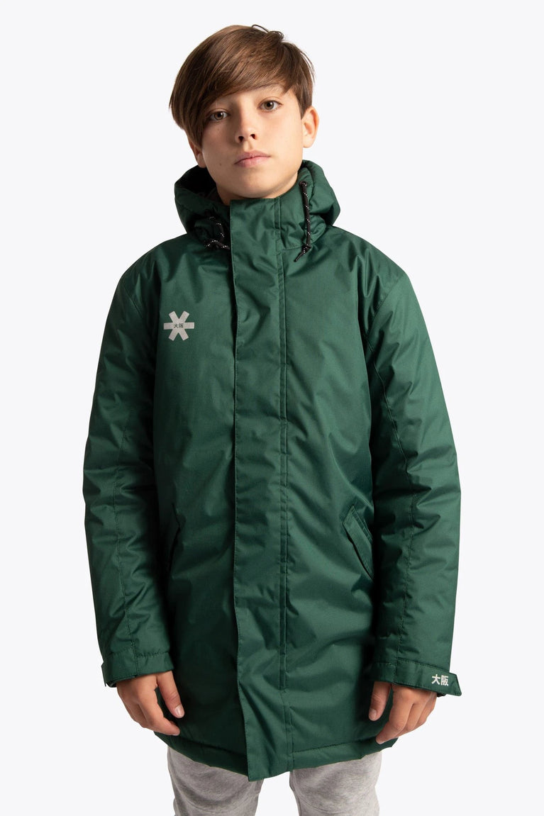 Boy wearing the Osaka Kids Stadium Jacket in Dark Green. Front view