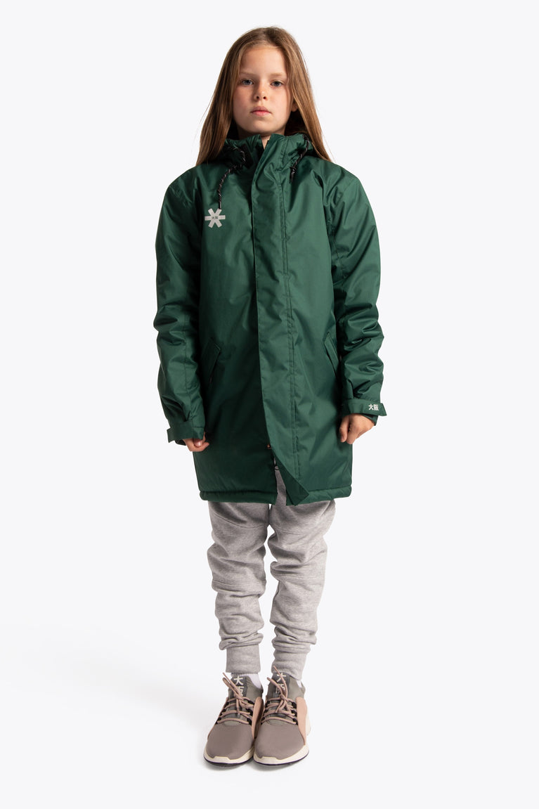 Girl wearing the Osaka Kids Stadium Jacket in Dark Green. Front view