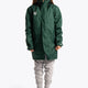 Girl wearing the Osaka Kids Stadium Jacket in Dark Green. Front view