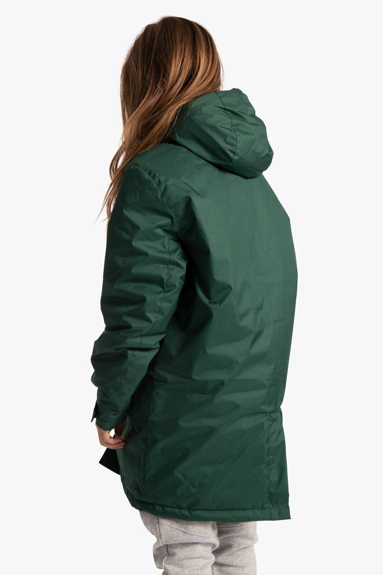 Girl wearing the Osaka Kids Stadium Jacket in Dark Green. Back view