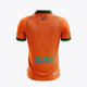 Kids orange polo jersey back view with green collar trim and large sponsor graphic