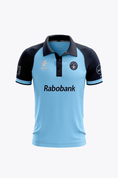 MHC Forescate Women Polo Jersey - Light Blue Light blue women's polo jersey with navy collar, button placket, dark sleeve panels.