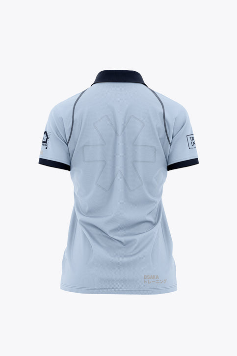 Udenhout Women Polo Jersey - Sky Blue Women’s sky blue polo jersey with navy collar, button placket, and front graphic print