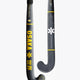 Ice hockey stick with black blade, gray shaft paneling, yellow stripes and printed marks