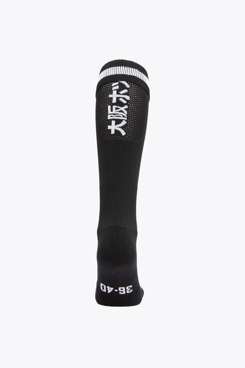 HC Zwart Wit Field Hockey Socks - Black HC Zwart Wit Field Hockey Socks with Osaka logo in green. Front view