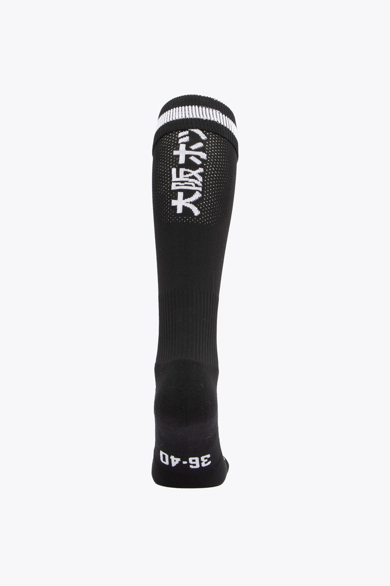 HC Zwart Wit Field Hockey Socks with Osaka logo in green. Back view view