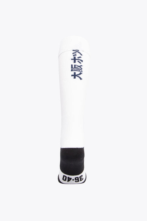 Hermes Field Hockey Socks - White Hermes Field Hockey Socks in white with Osaka logo in green. Front view