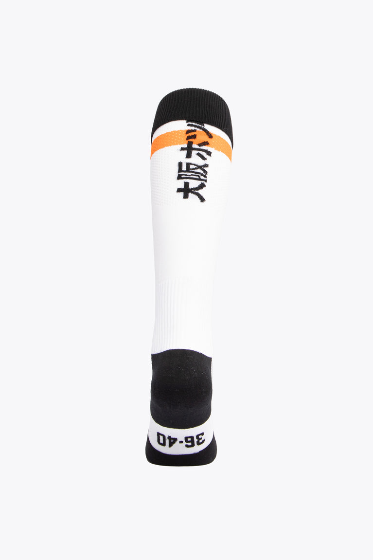MHCO Field Hockey Socks in white and orange with Osaka logo in green. Back view