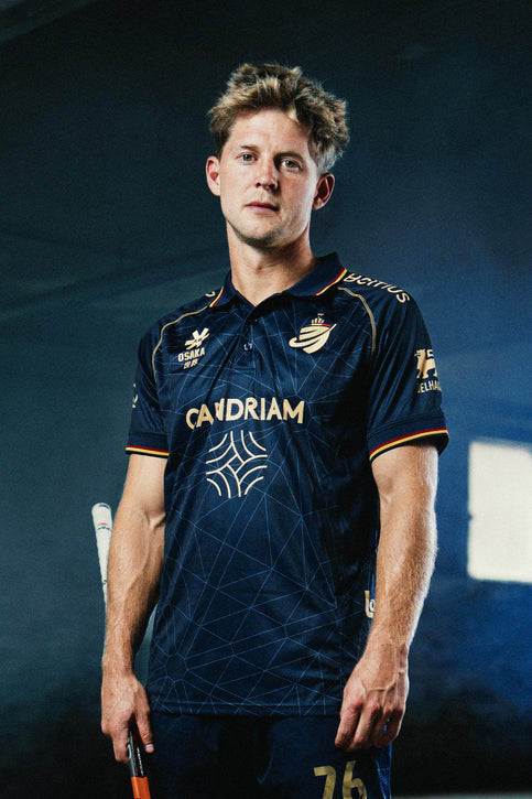 Men's navy polo jersey with button collar, short sleeves, and front sponsor graphics