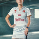 White women’s skort with Belfius and team crest prints on front