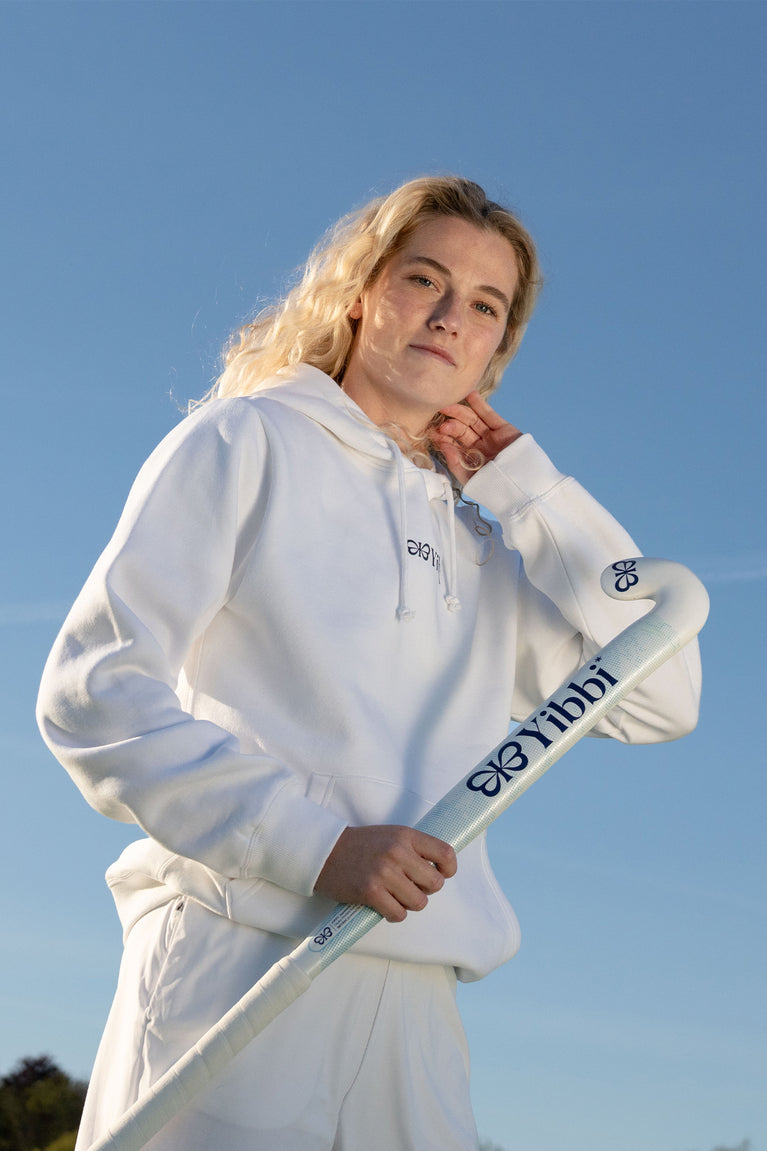 White adult hoodie with small chest logo, drawstring hood, and long sleeves