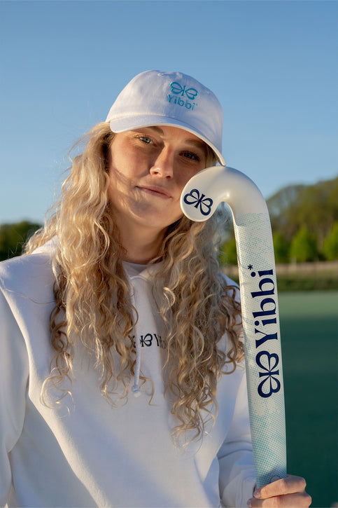 White Yibbi twill cap with embroidered front logo