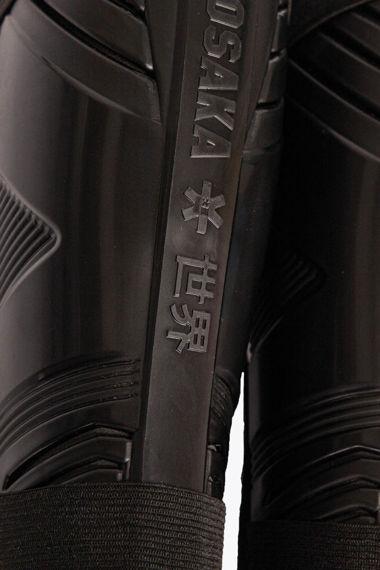 Osaka black shinguard with logo. Close view logo