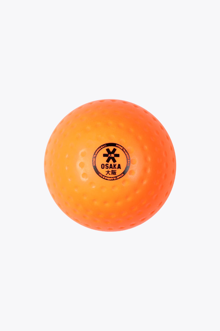 Fluo orange hockey training ball with dimple texture and Osaka logo