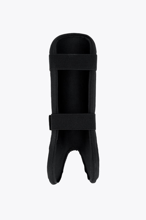Kids lime green shin guard with black straps and visible OSAKA logo