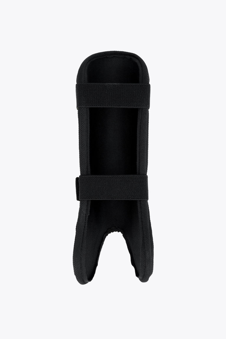 Kids black shin guard with padded shell and wide fastening strap