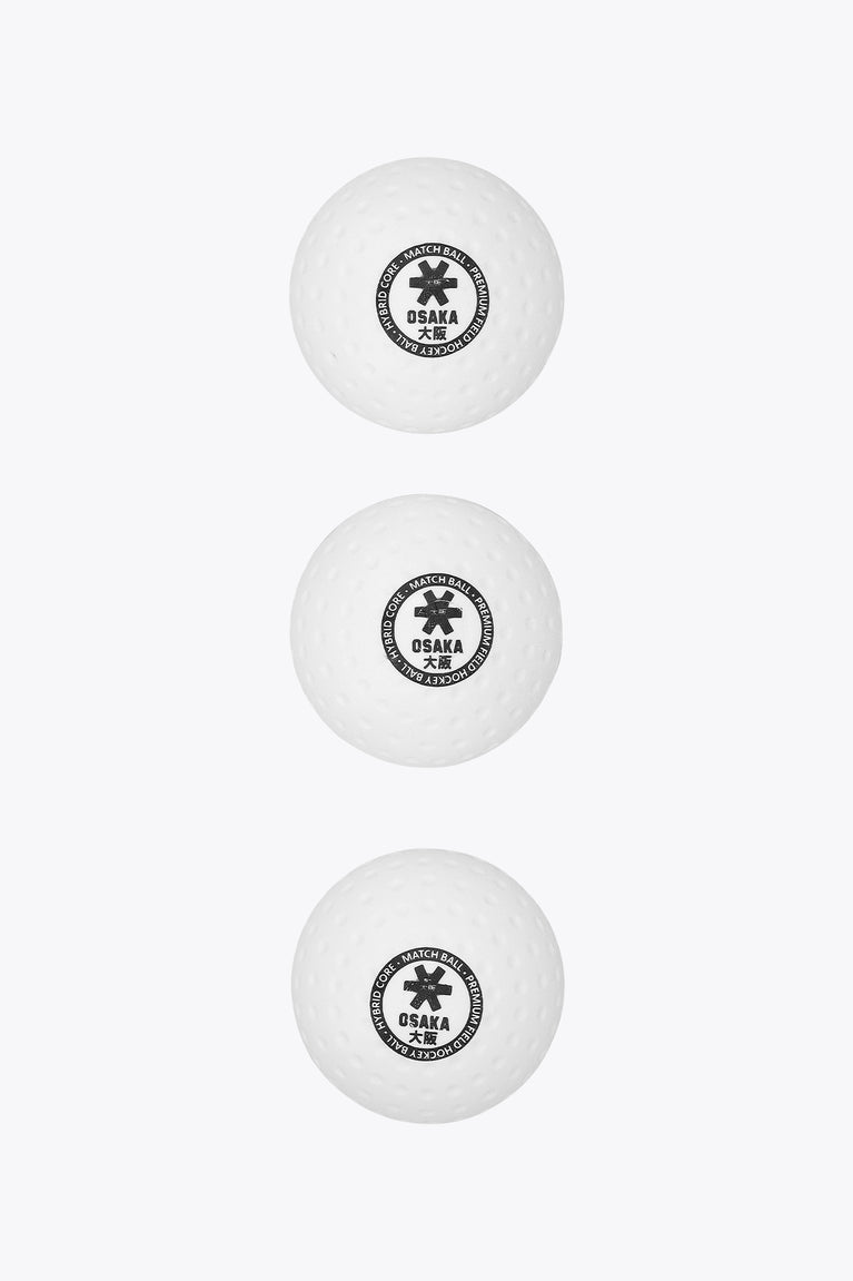 Three white Osaka field hockey match balls stacked vertically