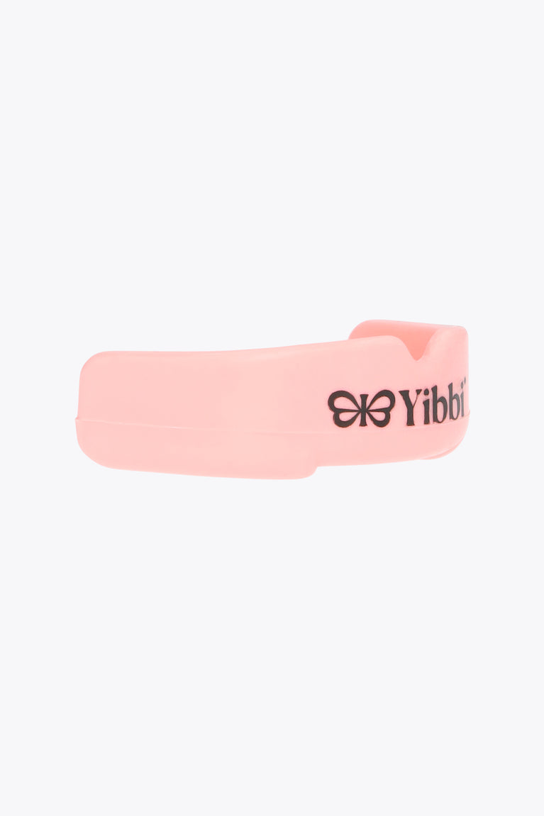 Pastel pink mouth guard with Yibbi logo side view