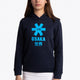 Girl wearing the Osaka kids hoodie in navy with blue star logo. Front view