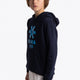 Boy wearing the Osaka kids hoodie in navy with blue star logo. Front/side view