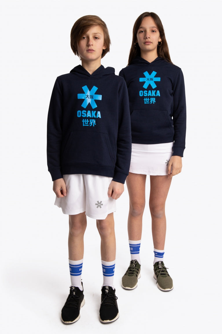 Boy and girl wearing the Osaka kids hoodie in navy with blue star logo. Front full view