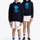 Boy and girl wearing the Osaka kids hoodie in navy with blue star logo. Front full view