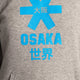 Osaka kids hoodie in grey with blue star logo. Detail logo view