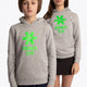 Boy and girl wearing the Osaka kids hoodie in grey with green star logo. Front view