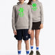 Boy and girl wearing the Osaka kids hoodie in grey with green star logo. Front full view