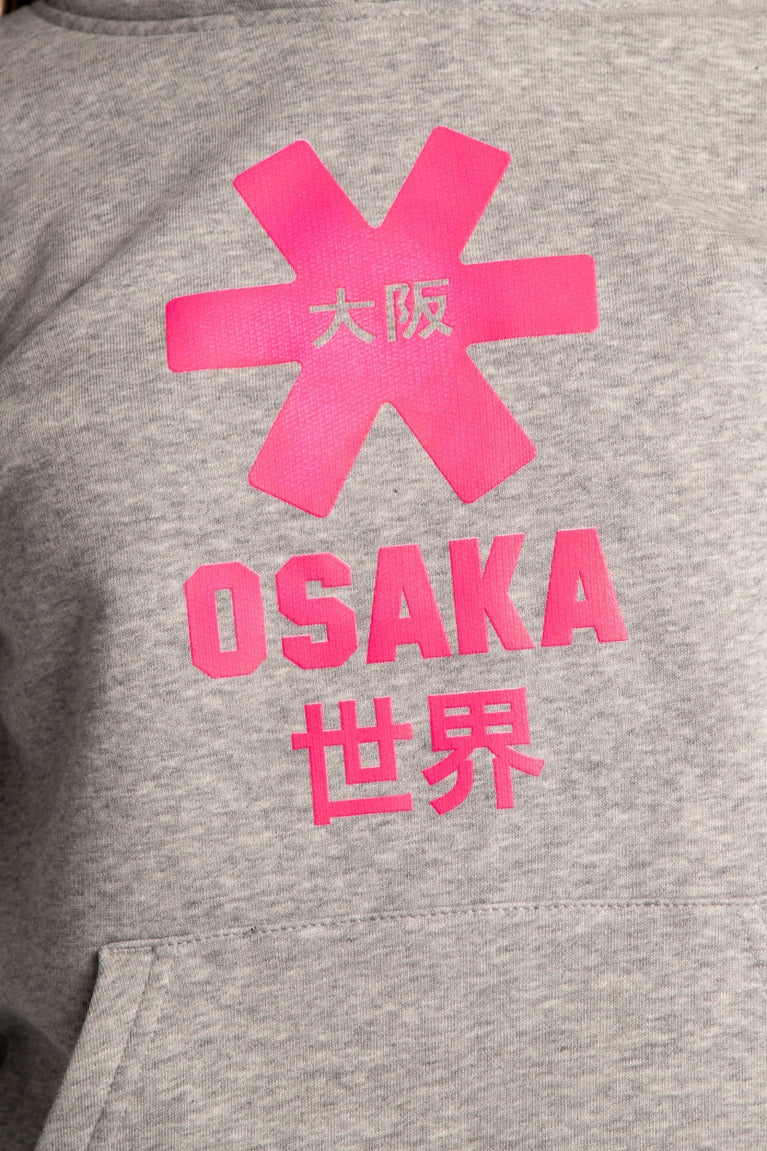 Osaka kids hoodie in grey with pink star logo. Detail view logo