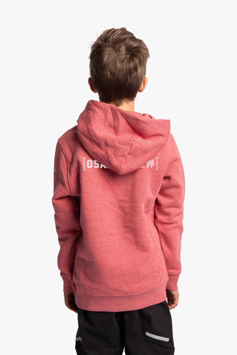 Boy wearing the Osaka kids trace hoodie in cranberry with logo in white and blue. Back view