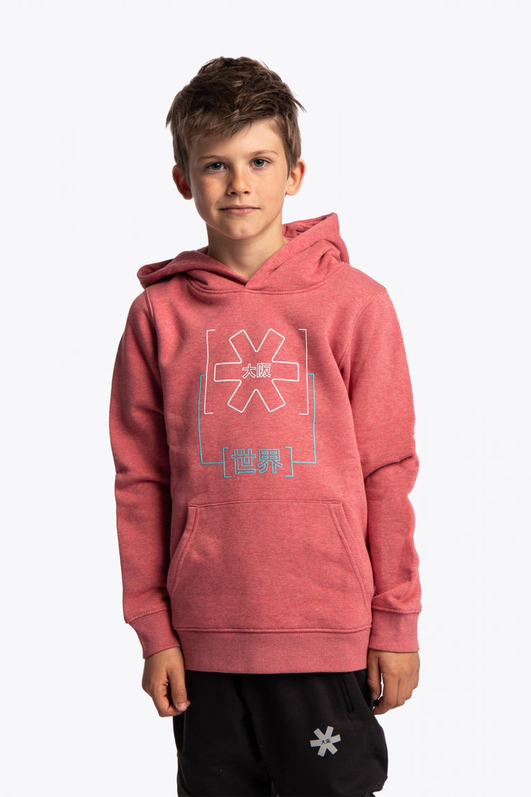 Boy wearing the Osaka kids trace hoodie in cranberry with logo in white and blue. Front view