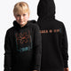 Girl wearing the Osaka kids trace hoodie in black with logo in orange and blue. Front and back view