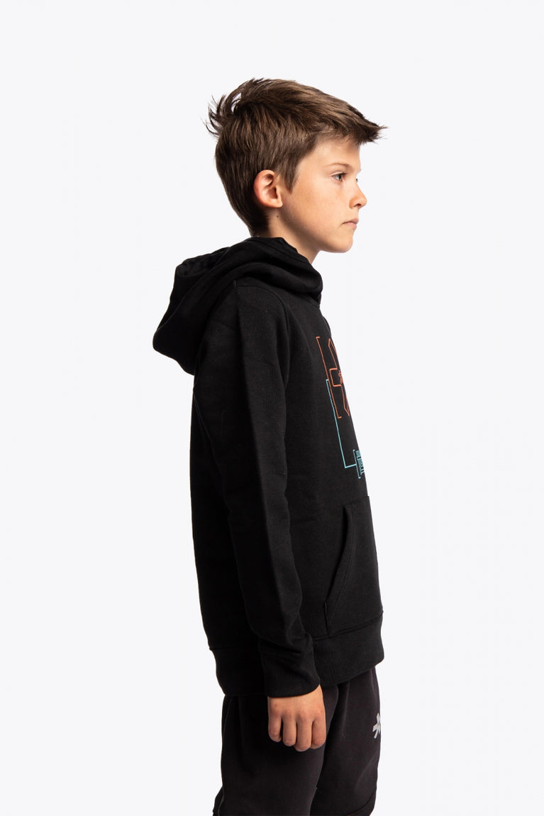 Boy wearing the Osaka kids trace hoodie in black with logo in orange and blue. Side view